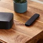 rear-surround-speaker-with-dolby-atmos-sitting-on-a-tabletop